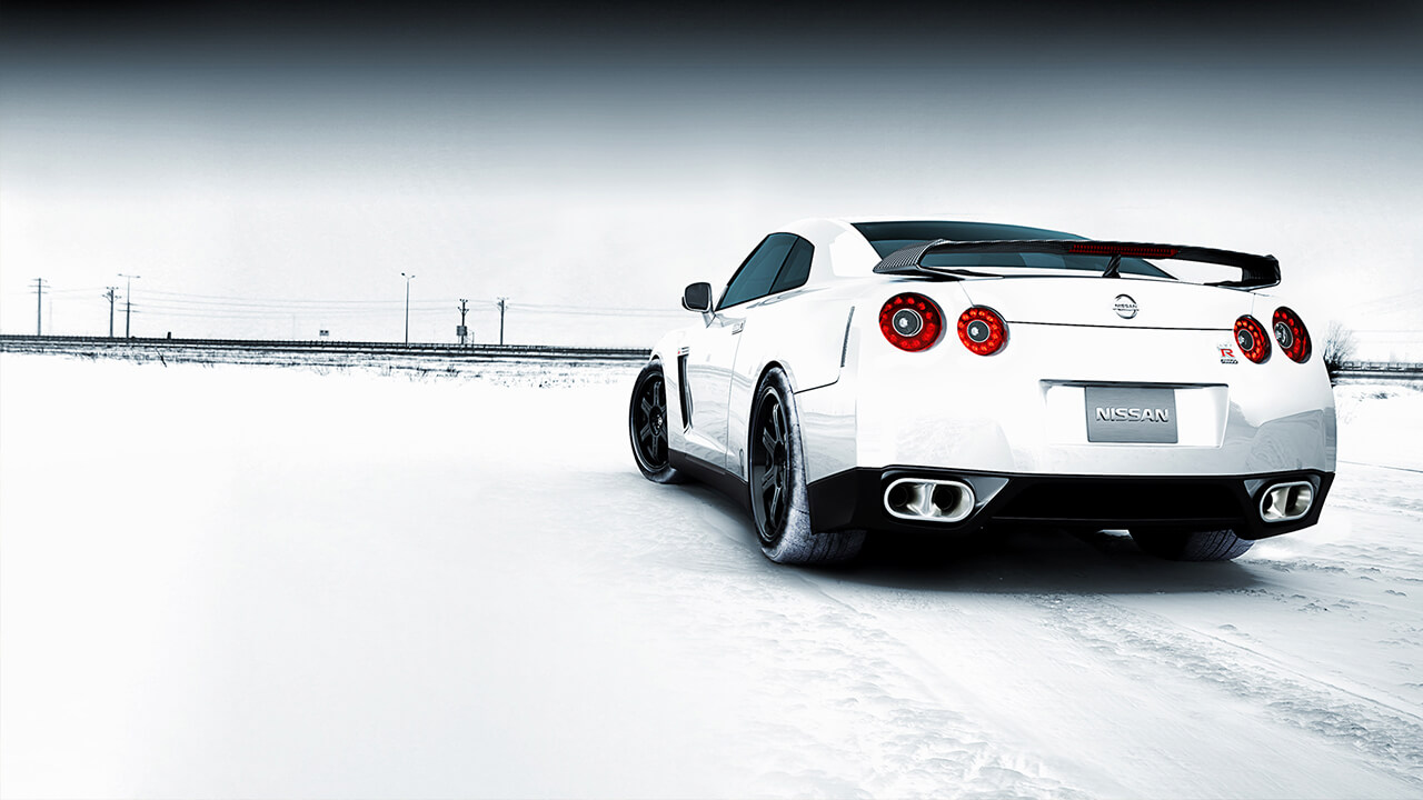 Image of rear view of Nissan sports car on icy road