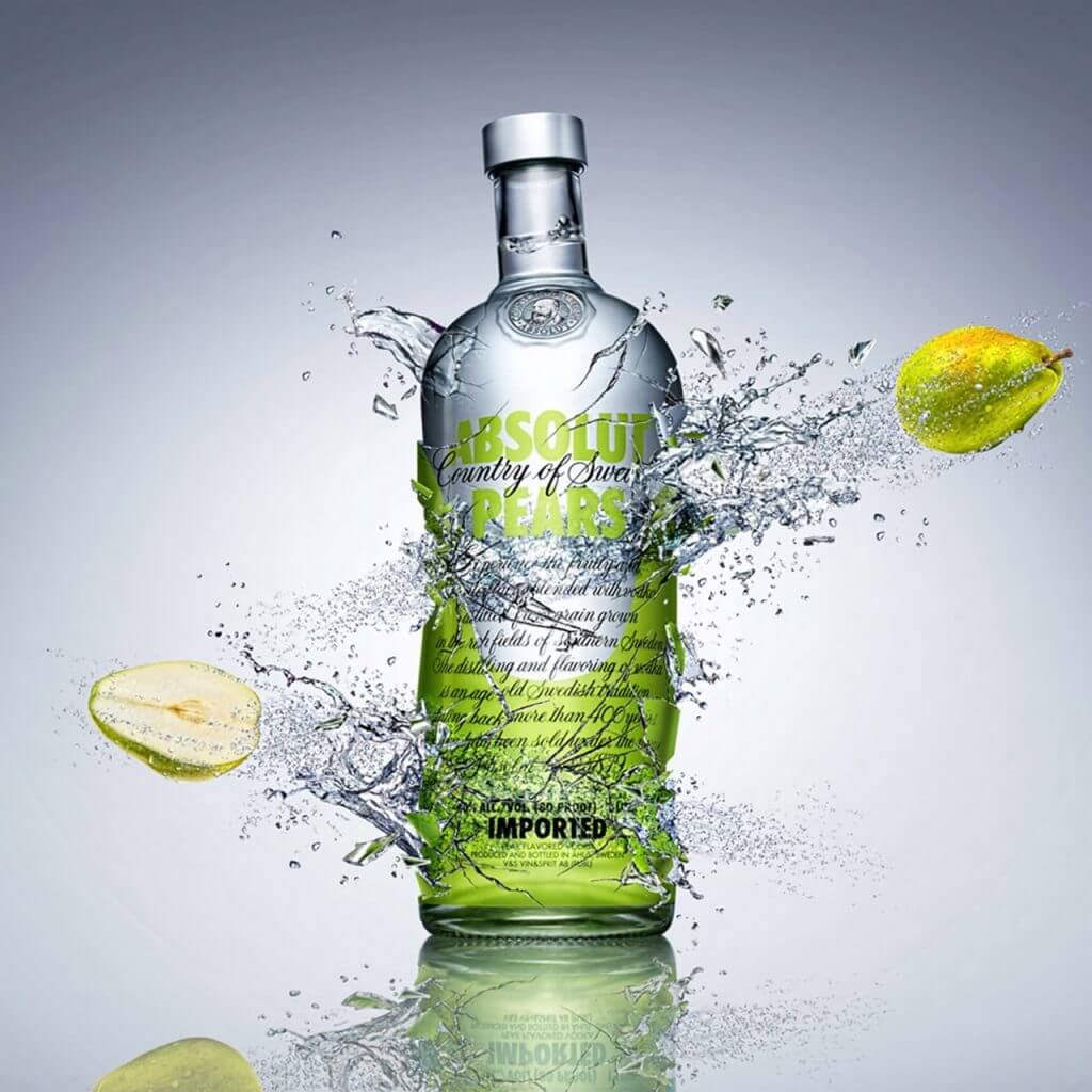 A computer Generated Image of a bottle shattering and liquid splashing and pears flying out - CGI Bottles