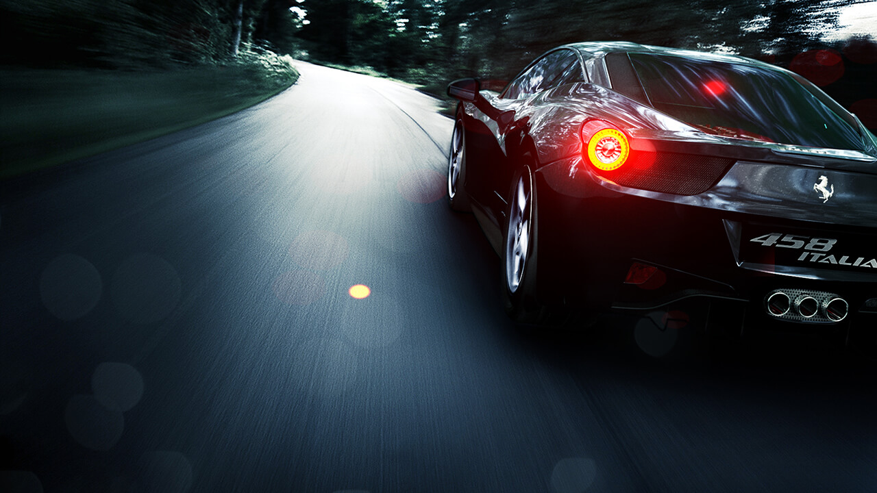 Computer generated image of a black sports car speeding along a road